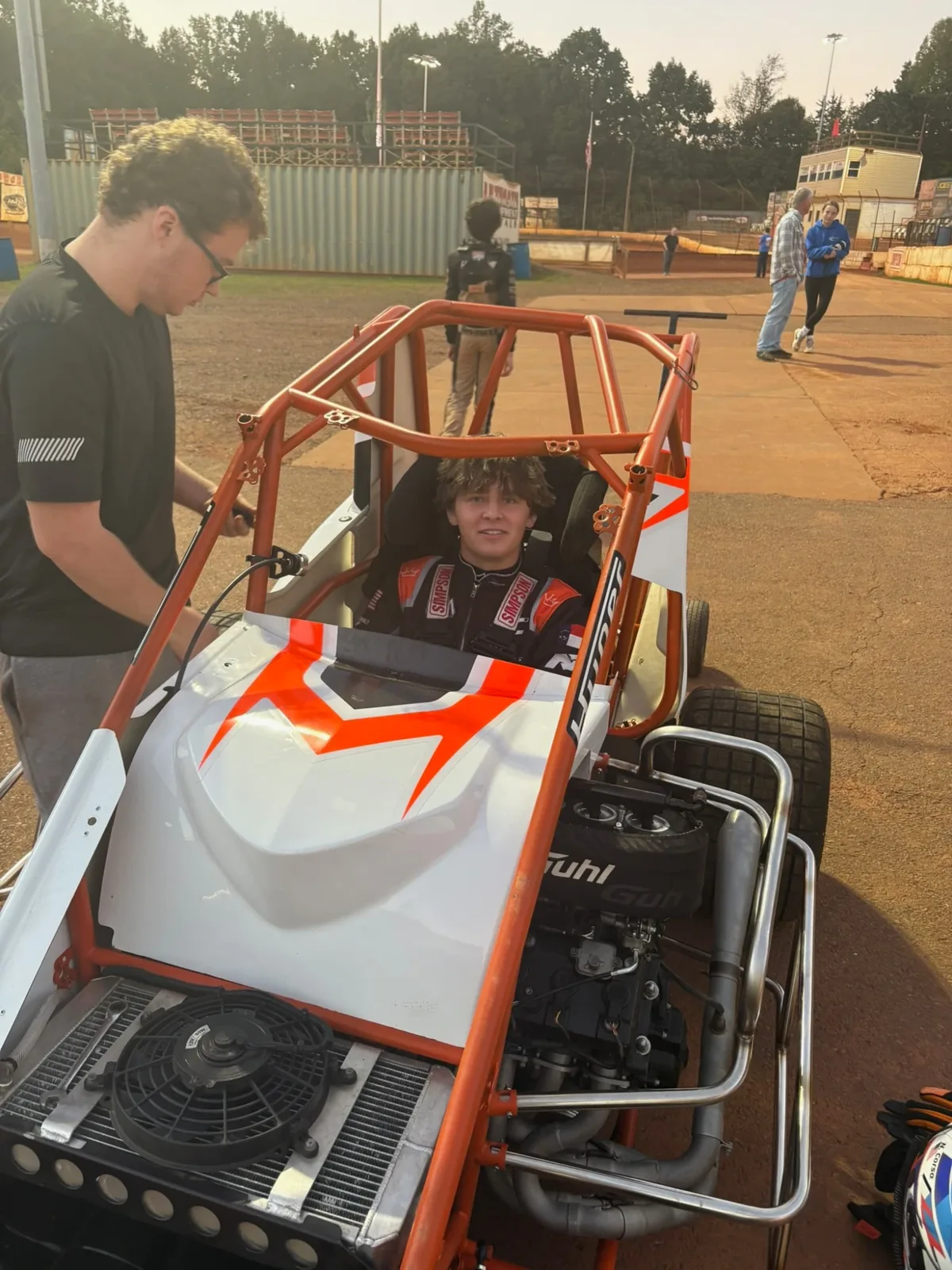 A micro sprint in the pits at a red-clay oval